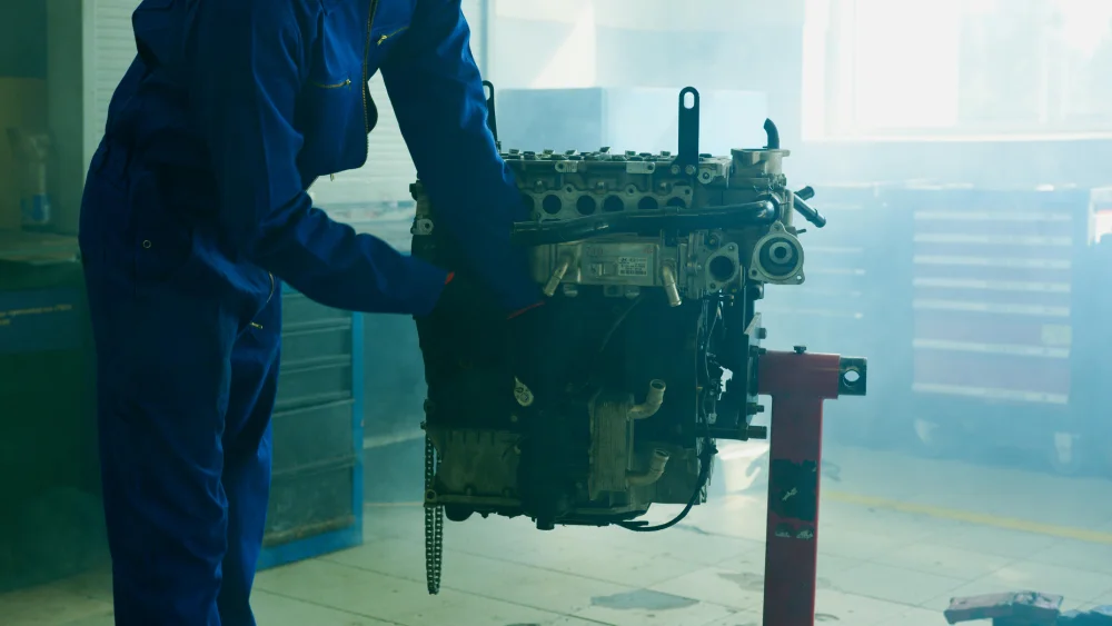 man working on engine